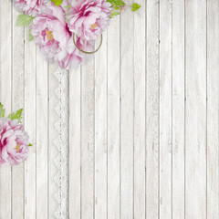 Vintage wooden background with beautiful pink peonies and lace  can be used as invitation card for wedding, birthday and other holiday and summer background