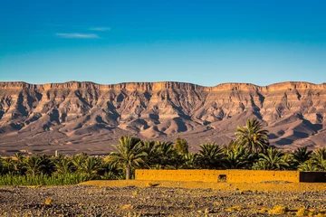 Fototapeten Landscape view on mountains with traditional architecture in Zagora province in Morocco © marketanovakova