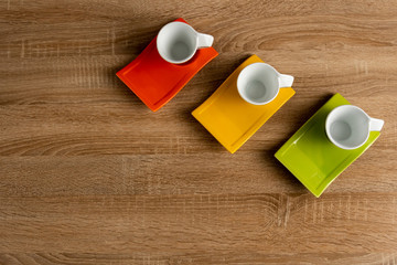Obraz na płótnie Canvas Three empty cups of coffee on desk on right corner