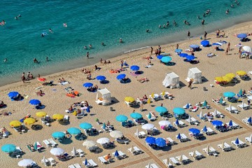 a picturesque beach view with a bird's eye view full of people resting in vacation