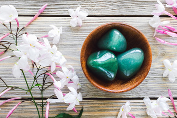 Teak Bowl of Green Aventurine with Jasmine on White Washed Wood