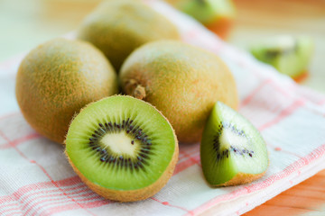 Kiwi slice on the table with kiwi fruit