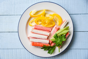 Crab sticks with sweet bell peppers and fresh Celery vegetable on plate food