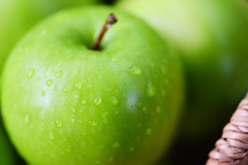 Fresh green Apples - harvest apple in the basket in the garden fruit nature green background
