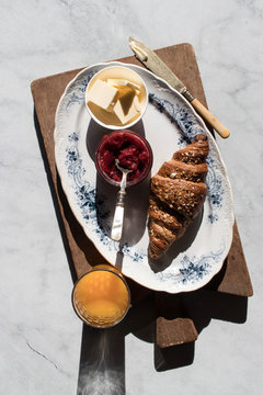 Overhead view of breakfast served on cutting board
