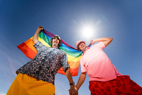 Excited plump gay couple in desert