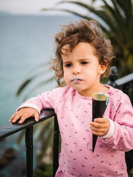 Girl eating an ice cream outdoors