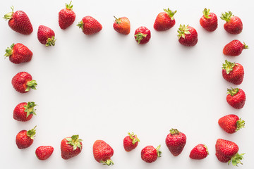 top view of sweet and fresh strawberries on white background