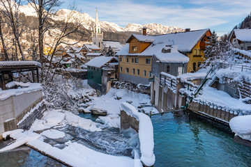 Small hydro electric power plant in Schladming. Winter scenery and snow-covered alpine mountains, Styria, Austria, Europe.