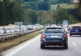 Fototapeta na wymiar Cars driving on highway in traffic jam