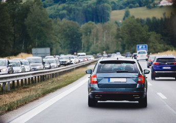 Fototapeta premium Cars driving on highway in traffic jam