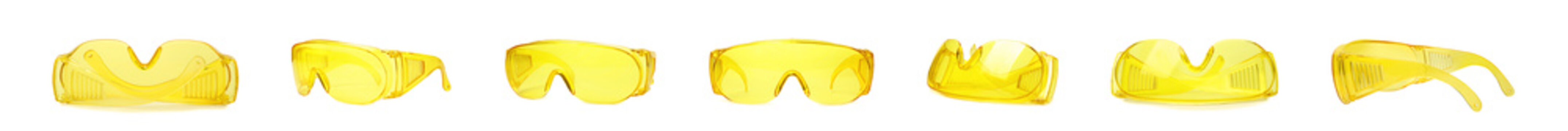Set of yellow protective goggles on white background. Banner design