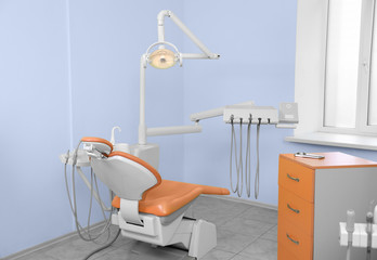 Dentist's office with modern chair and professional equipment