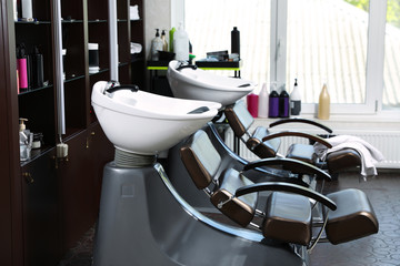 Modern hairdressing salon interior with professional equipment