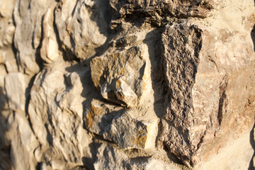 Background, material, texture of a natural stone facade