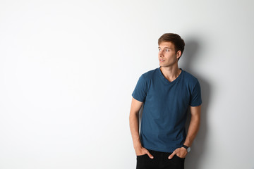 Portrait of handsome man on light background. Space for text