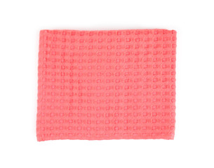 Folded coral kitchen towel on white background, top view