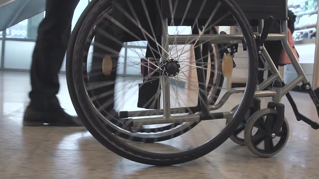 Person Pushing Wheelchair