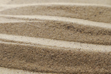 Patterns drawn on yellow sand