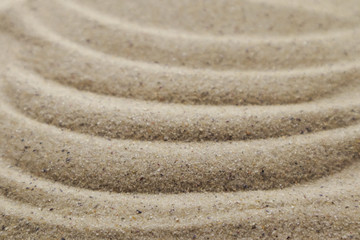 Fototapeta na wymiar Patterns drawn on yellow sand