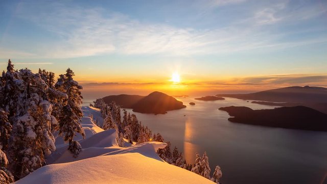 Beautiful Canadian Landscape view during a colorful winter sunset. Taken from top of Mnt Harvey, North of Vancouver, BC, Canada. Still Image Continuous Animation