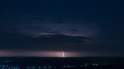 lightning on a nocturnal background, full of stars