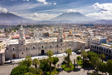 Aerial drone view of Arequipa main square and cathedral church, with the Misti volcano as background. - obrazy, fototapety, plakaty