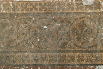 The texture of an old concrete wall with drawings and patterns.