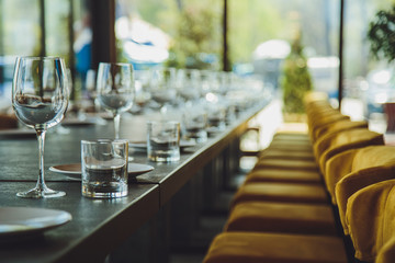 Glass goblets on the table. Served table. Table setting