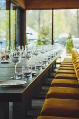 Glass goblets on the table. Served table. Table setting