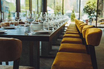 Glass goblets on the table. Served table. Table setting