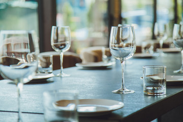 Glass goblets on the table. Served table. Table setting