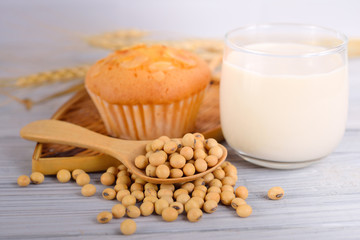 soybean milk and soybeans on wooden background