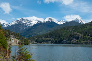 Fototapeta na wymiar View over Green Lake to snow-capped Wedge Mountain, Whistler