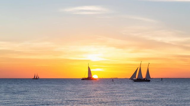Beautiful golden sunset viewed from Mallory Square in Key West, Florida Keys, United States. Still Image Continuous Animation