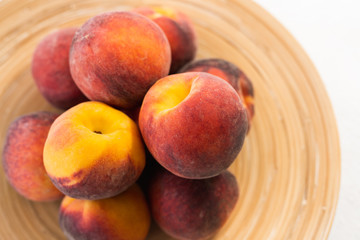 Fototapeta na wymiar Fresh Ripe Peaches on a Plate, View from Above