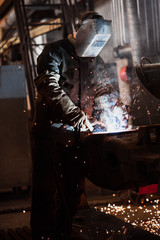 welder during operation.sparks from welding