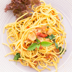 Delicious spaghetti served on white plate