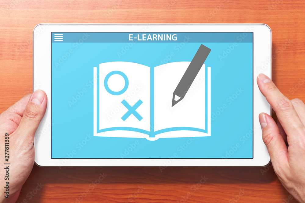 Fototapete E-learning concept image. Closeup of hands touching white tablet computer on wooden desk. Application of problems collection on screen. Front view image.