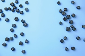 Many ripe blueberry on color background