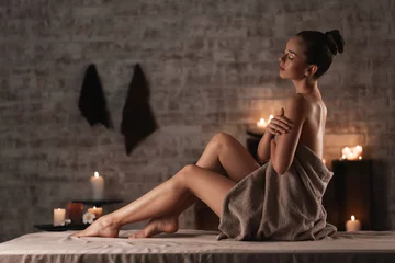 Raamstickers Beautiful young woman relaxing in spa salon © Pixel-Shot