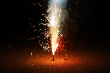 fountain fireworks stream into dark night