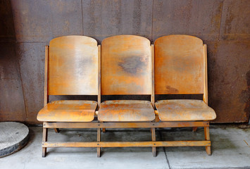 Set three wooden chairs at balcony.