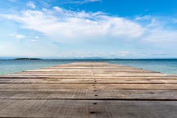 Fototapeta na wymiar Wood Vintage Terrace on the beach with blue Sea, Ocean, Sky Background