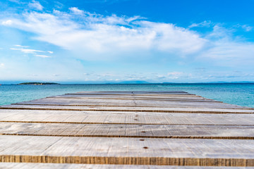 Fototapeta premium Wood Vintage Terrace on the beach with blue Sea, Ocean, Sky Background