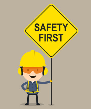 Worker holding safety first sign, Vector illustration, Safety and accident, Industrial safety cartoon