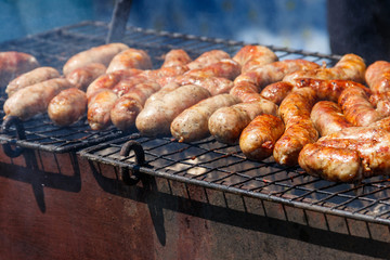 Sausages cooking on a grill