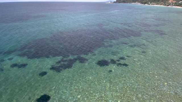 Aerial view of amazing sea  in the area of Agia Paraskevi Halkidiki, Greece, move forward by drone