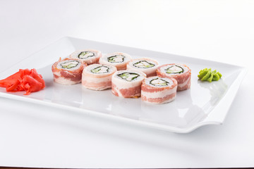 Japanese sushi roll with bacon and cheese isolated on white background