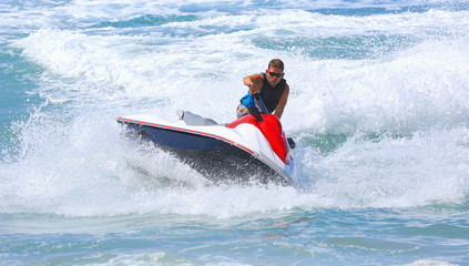 Man on jet ski jump on the wave